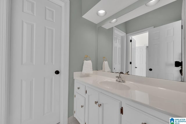 bathroom with recessed lighting and vanity