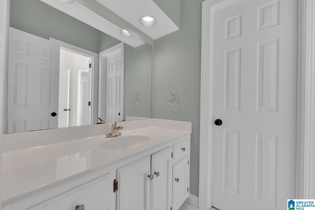 bathroom featuring vanity and recessed lighting