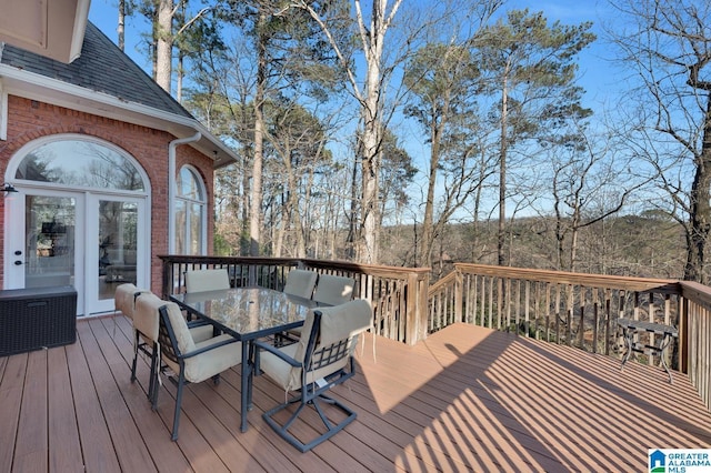 deck featuring outdoor dining area