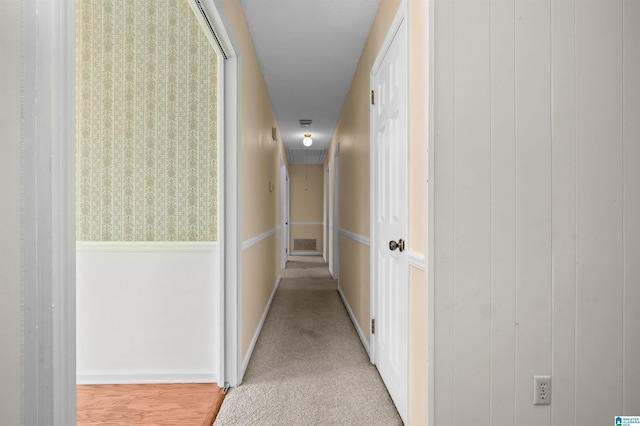 corridor with carpet floors