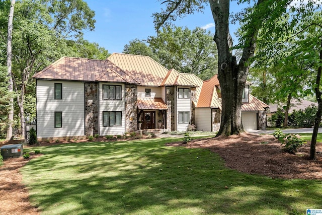 890 River Oaks Dr, Cropwell, AL 35054 - view of front of house featuring metal roof, a front lawn, and stone siding