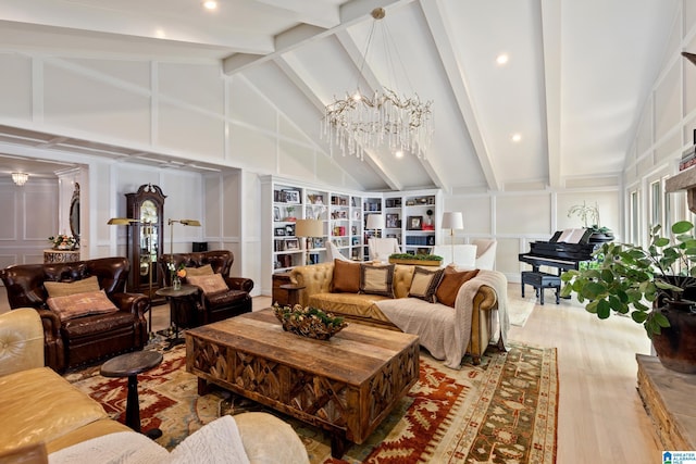 890 River Oaks Dr, Cropwell, AL 35054 - living room with wood finished floors, beam ceiling, built in features, a decorative wall, and a chandelier