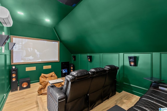 890 River Oaks Dr, Cropwell, AL 35054 - home theater room featuring vaulted ceiling, a wall mounted AC, and wood finished floors