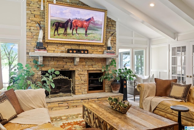 890 River Oaks Dr, Cropwell, AL 35054 - living area featuring lofted ceiling with beams, a decorative wall, and wood finished floors
