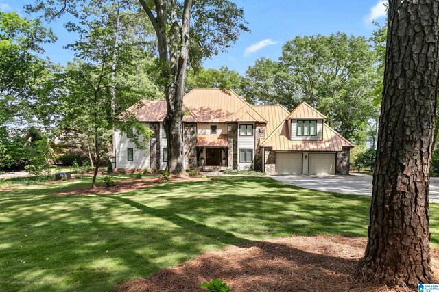 890 River Oaks Dr, Cropwell, AL 35054 - view of front facade with concrete driveway, an attached garage, a front lawn, and stone siding