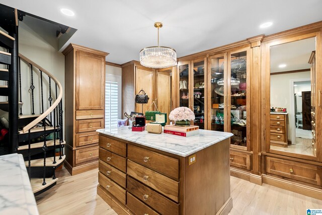 890 River Oaks Dr, Cropwell, AL 35054 - spacious closet featuring an inviting chandelier and light wood-style flooring