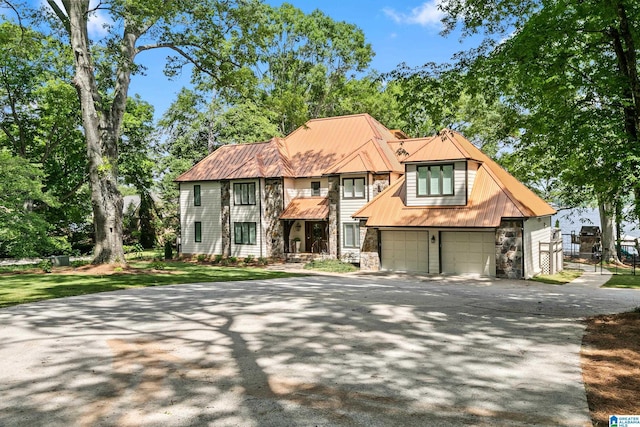 890 River Oaks Dr, Cropwell, AL 35054 - english style home featuring metal roof, concrete driveway, and stone siding