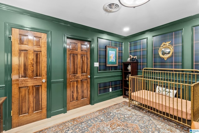 890 River Oaks Dr, Cropwell, AL 35054 - bedroom with a decorative wall, visible vents, wood finished floors, and ornamental molding