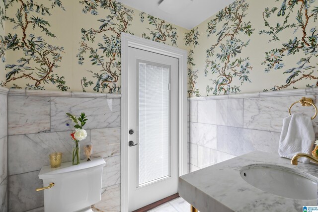 890 River Oaks Dr, Cropwell, AL 35054 - half bathroom with a wainscoted wall, tile walls, toilet, and wallpapered walls