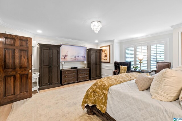 890 River Oaks Dr, Cropwell, AL 35054 - bedroom with crown molding, a decorative wall, and light wood-type flooring