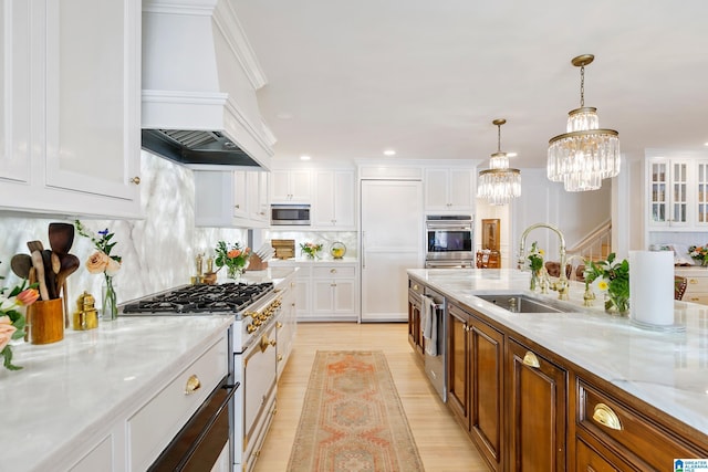 890 River Oaks Dr, Cropwell, AL 35054 - kitchen with a sink, stainless steel appliances, light wood-type flooring, white cabinets, and custom range hood