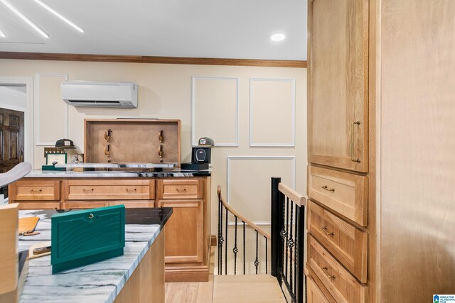 890 River Oaks Dr, Cropwell, AL 35054 - kitchen with light stone counters, light wood finished floors, crown molding, and an AC wall unit