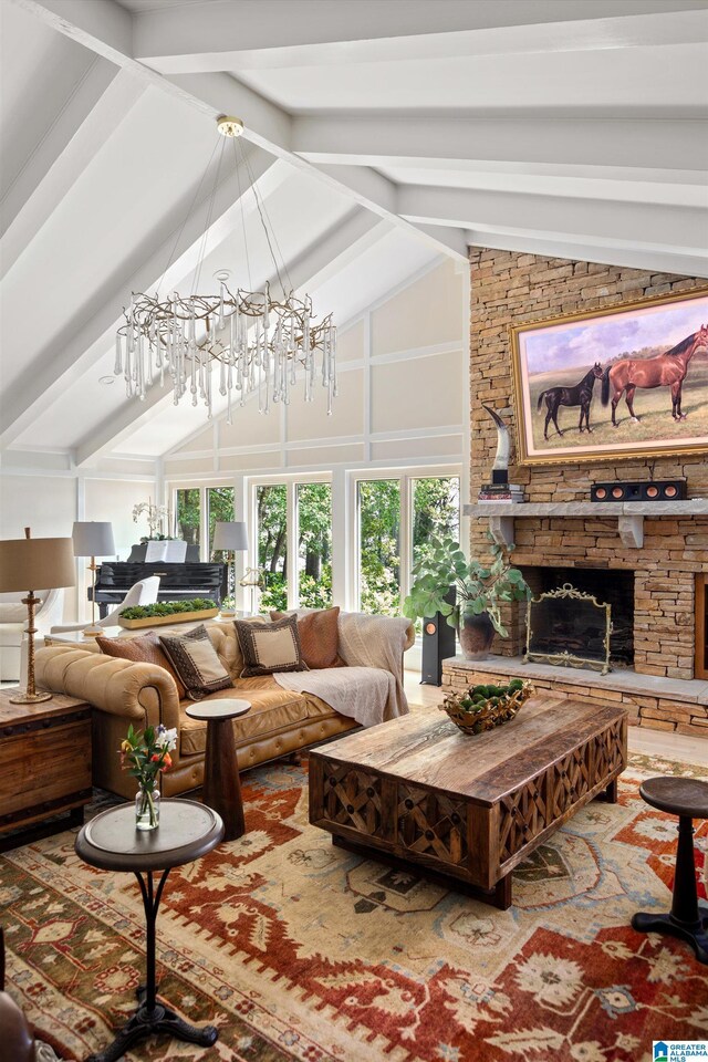 890 River Oaks Dr, Cropwell, AL 35054 - living area with an inviting chandelier, beam ceiling, a stone fireplace, and high vaulted ceiling