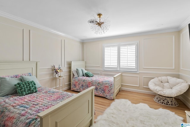 890 River Oaks Dr, Cropwell, AL 35054 - bedroom featuring ornamental molding, a decorative wall, and light wood-style floors