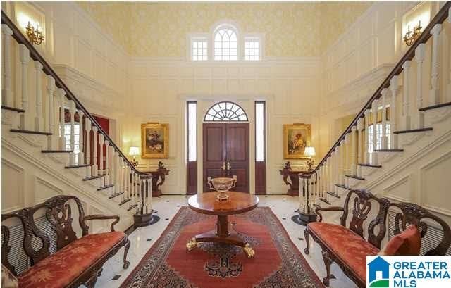 foyer entrance with a wealth of natural light and a high ceiling