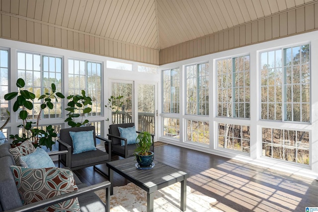 sunroom featuring plenty of natural light and vaulted ceiling