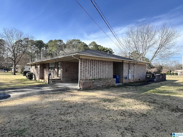 view of side of property with a lawn