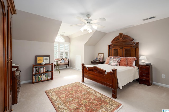 bedroom featuring lofted ceiling, light colored carpet, visible vents, ceiling fan, and baseboards