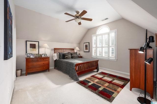 bedroom with light carpet, baseboards, visible vents, and lofted ceiling