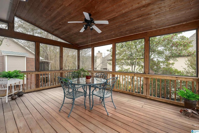 unfurnished sunroom with lofted ceiling, wooden ceiling, and ceiling fan