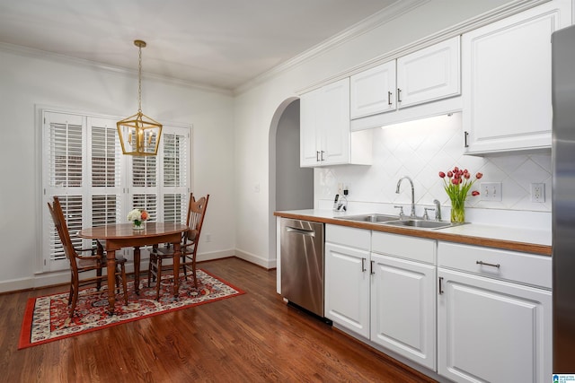 kitchen featuring a sink, white cabinetry, light countertops, hanging light fixtures, and dishwasher