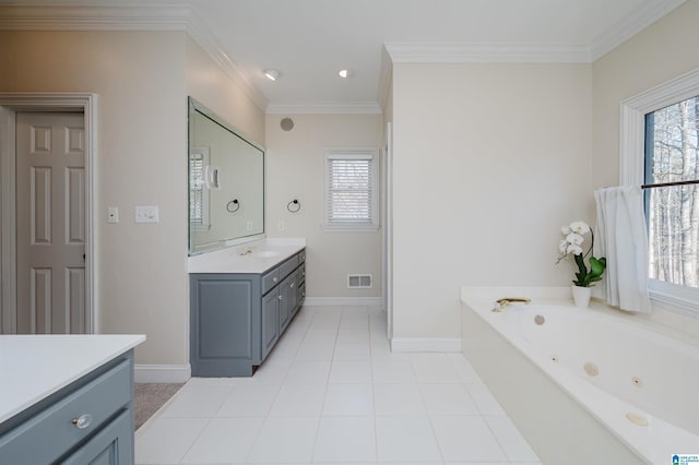 bathroom with a tub with jets, visible vents, crown molding, and vanity