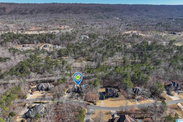 aerial view featuring a wooded view