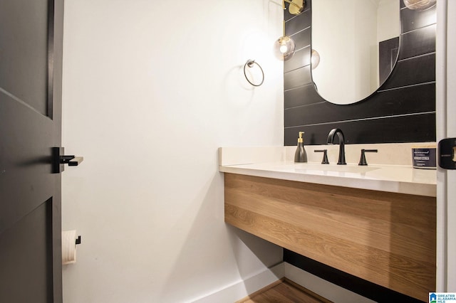 bathroom with vanity and baseboards