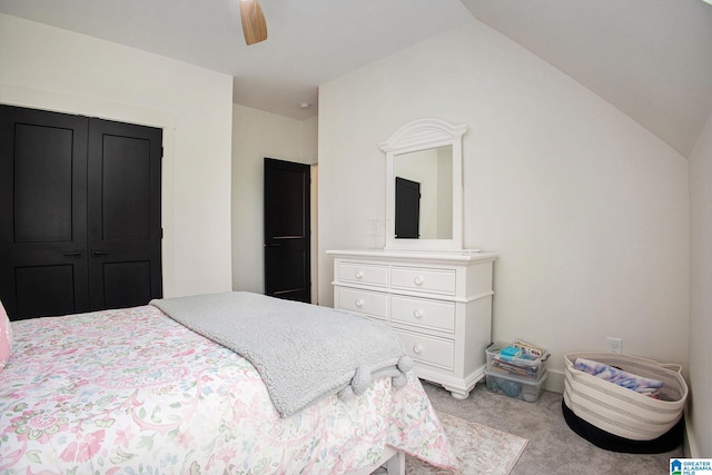 carpeted bedroom featuring lofted ceiling and ceiling fan