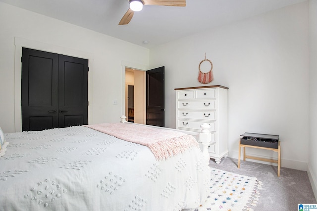 bedroom featuring light carpet, ceiling fan, and baseboards