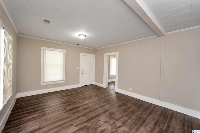 unfurnished room featuring crown molding and dark hardwood / wood-style floors