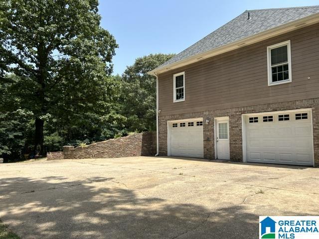 view of property exterior featuring a garage