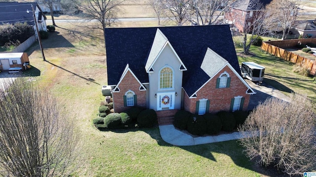 view of front of home with a front lawn and stucco siding