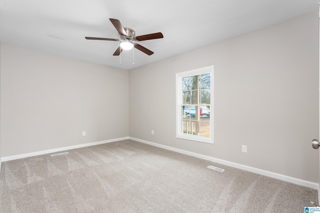 carpeted empty room with ceiling fan