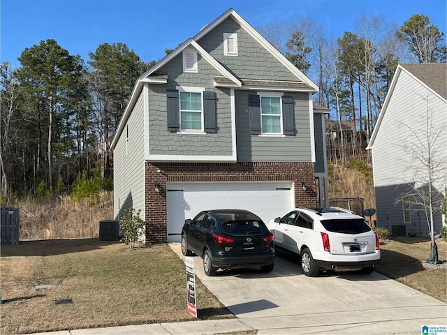 view of front of house with a garage, central AC, concrete driveway, and brick siding