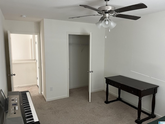 unfurnished bedroom with carpet floors, a closet, a ceiling fan, and baseboards