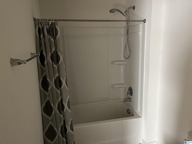 full bathroom featuring shower / bathtub combination with curtain