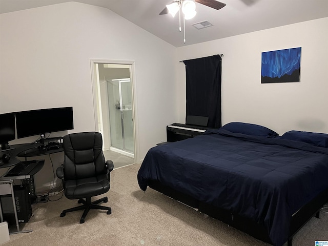 bedroom with carpet floors, visible vents, ensuite bathroom, a ceiling fan, and vaulted ceiling