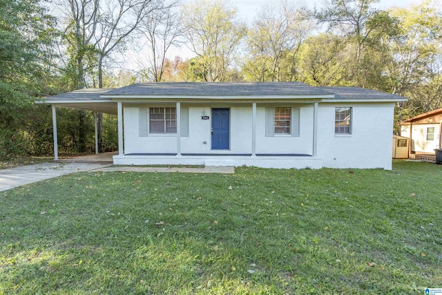 single story home with a carport, a front yard, and a porch