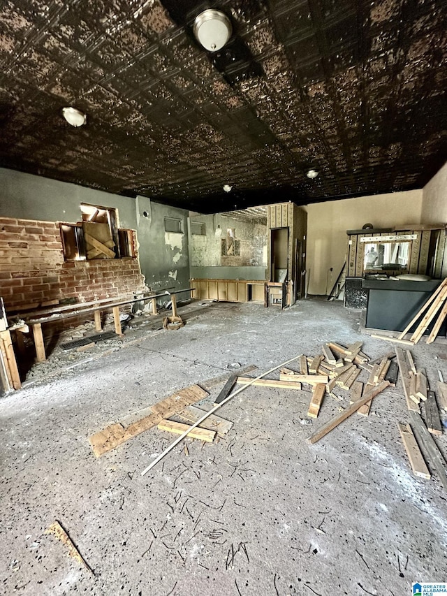 miscellaneous room with brick wall