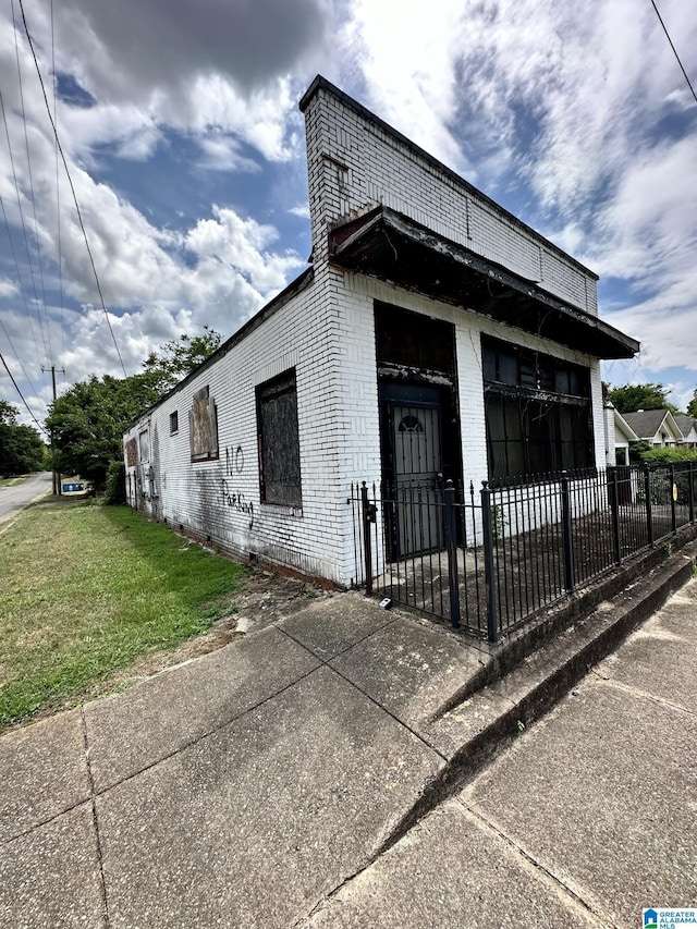 view of side of home featuring a yard