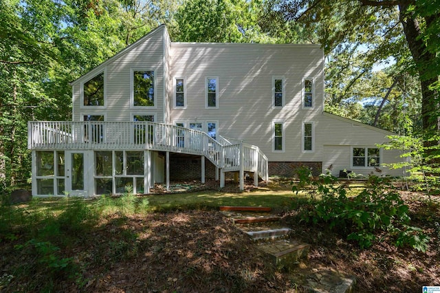 back of house with a deck and a sunroom