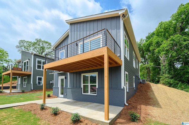 contemporary home featuring central AC and a patio area