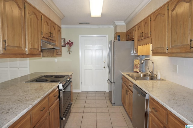 kitchen with sink, ornamental molding, light stone counters, light tile patterned floors, and appliances with stainless steel finishes