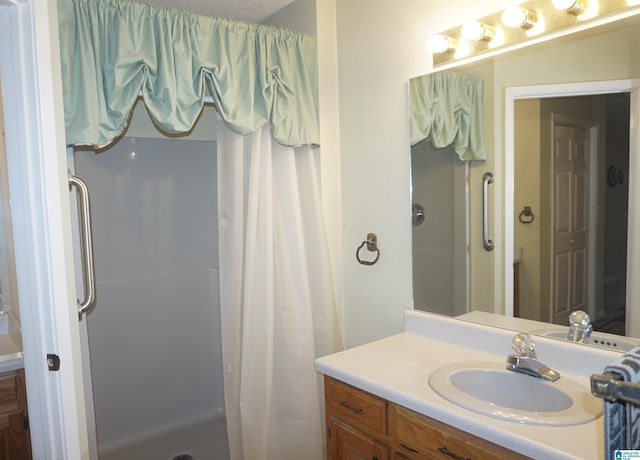 bathroom featuring vanity and walk in shower