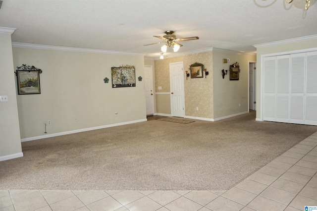 unfurnished living room with a textured ceiling, ceiling fan, light colored carpet, and ornamental molding