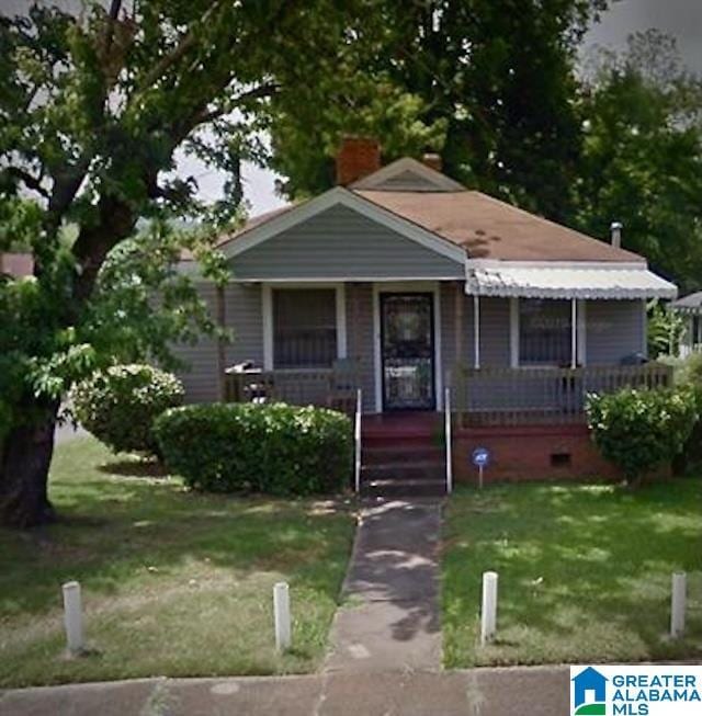 bungalow-style home with a porch and a front yard