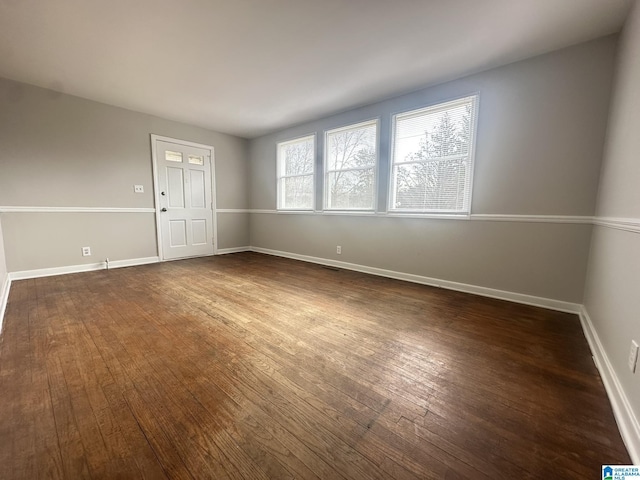 unfurnished room featuring dark hardwood / wood-style floors