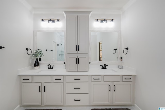 bathroom featuring double vanity, ornamental molding, and a sink