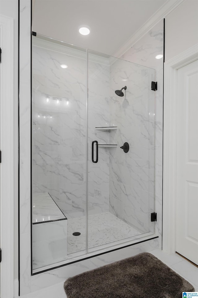 full bathroom with ornamental molding and a marble finish shower